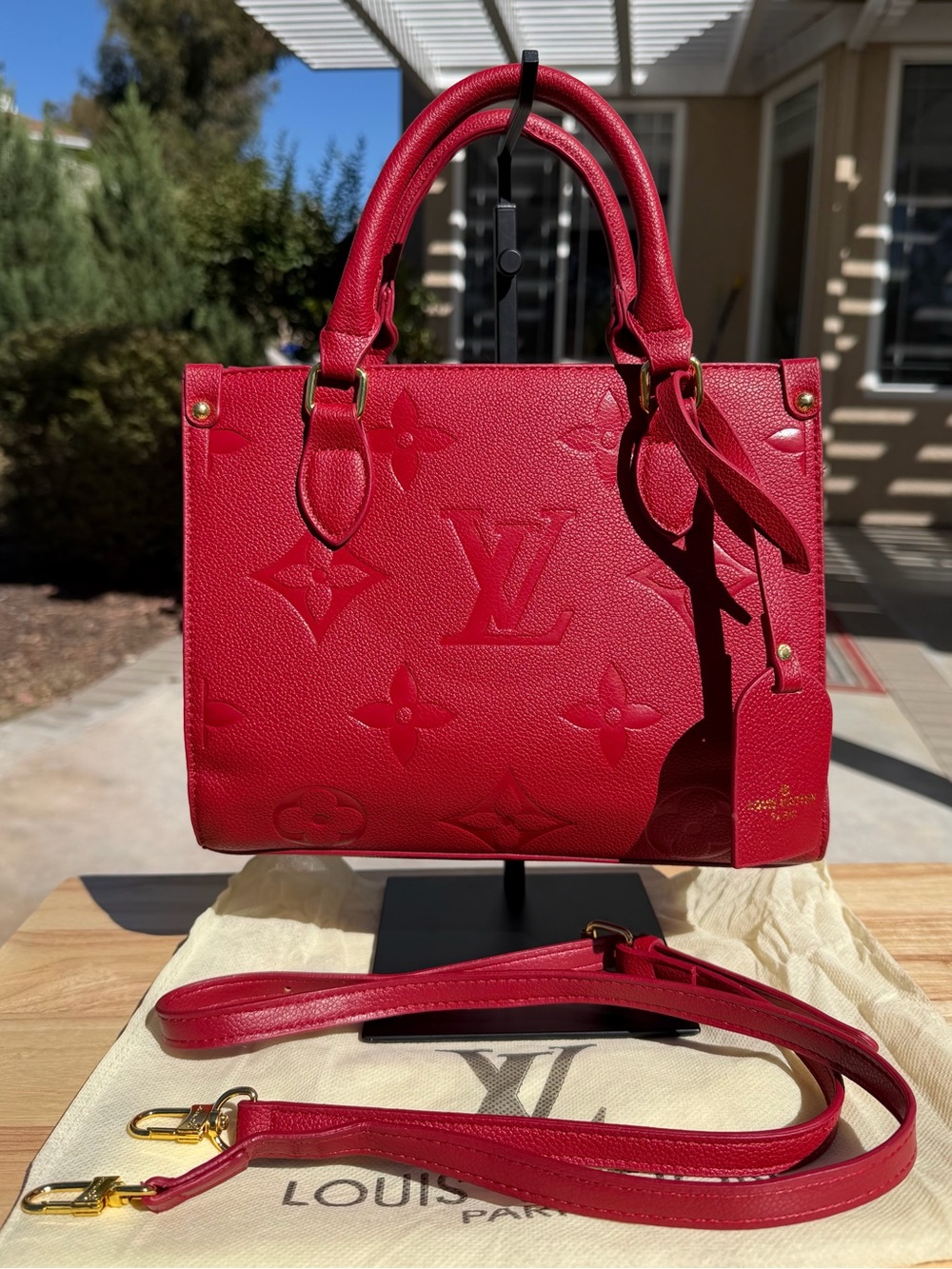 Red Monogram Embossed Top Handle Tote Bag